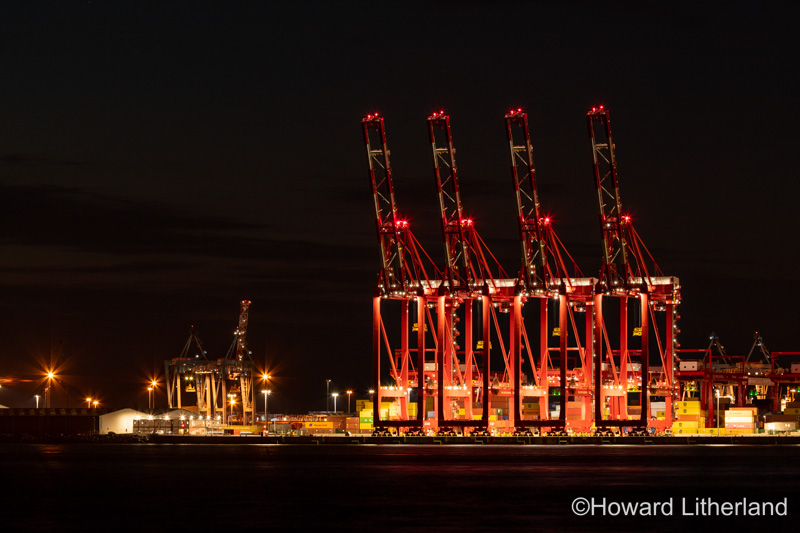 Red cranes at night at Liverpool 2 Container terminal, England