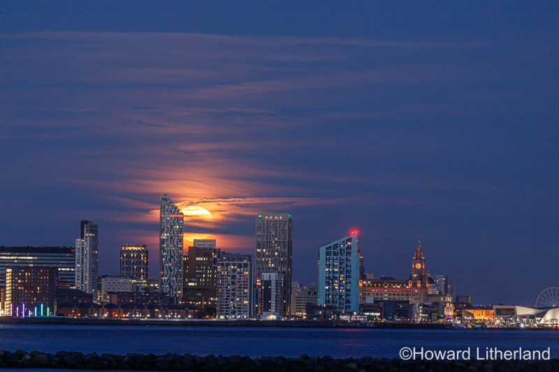 Supermoon rising over the Liverpool waterfront skyline, Merseyside, England