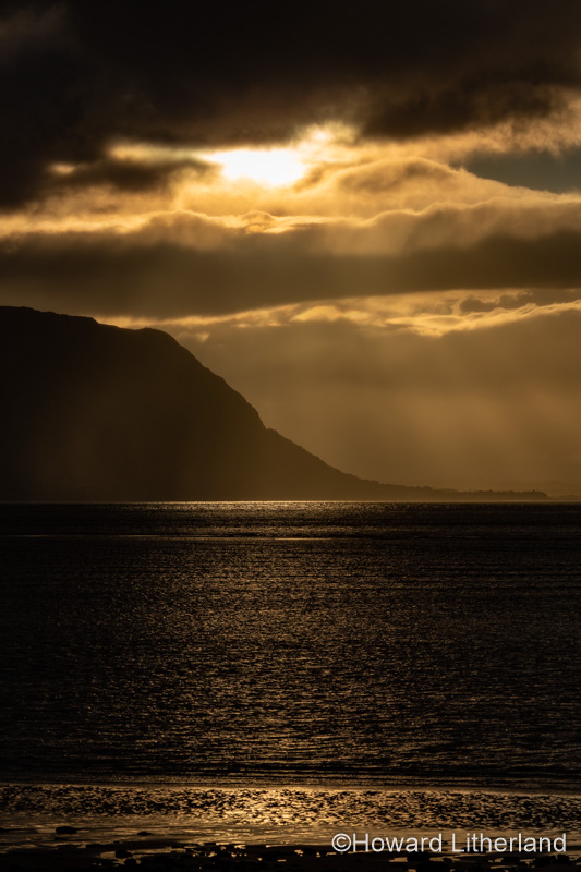 Sunset with clouds over the Irish Sea at Llandudno, North Wales