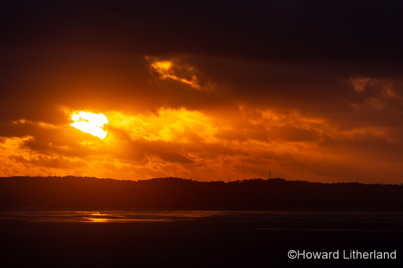 Sunset with clouds over the Irish Sea at Llandudno, North Wales