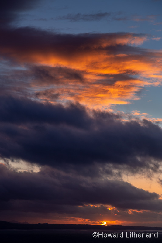 Sunset with clouds over the Irish Sea at Llandudno, North Wales