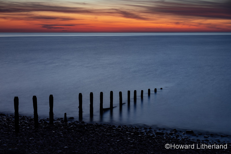 Groynes at dusk at Llandulas on the North Wales coast