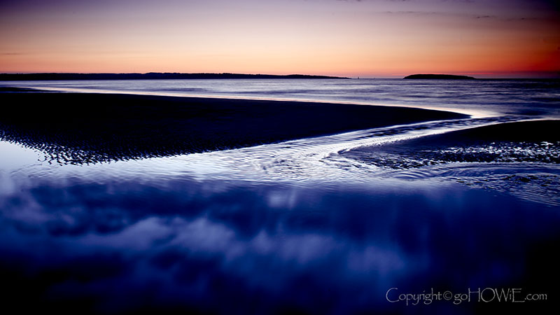 Tidal pool at dusk on Llanfairfechan beach, Wales