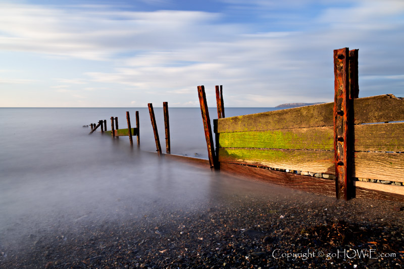 Decaying groynes on the beach at Llanfairfechan, North Wales coast