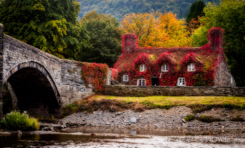 The Tu Hwnt-I'r Bont cottage tea rooms and old stone bridge in autumn colours at Llanrwst, North Wales