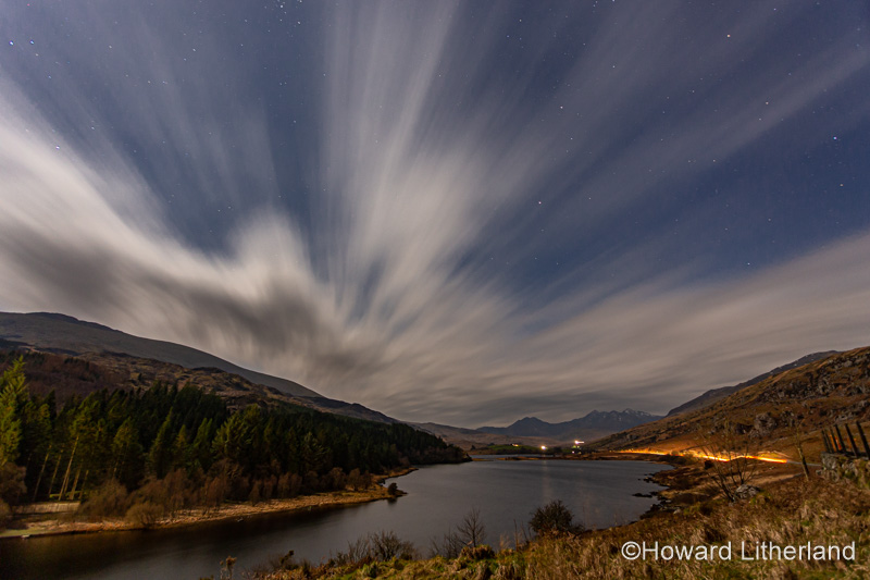 Stars and clouds over Llyn Mymbyr at night, Snowdonia, North Wales