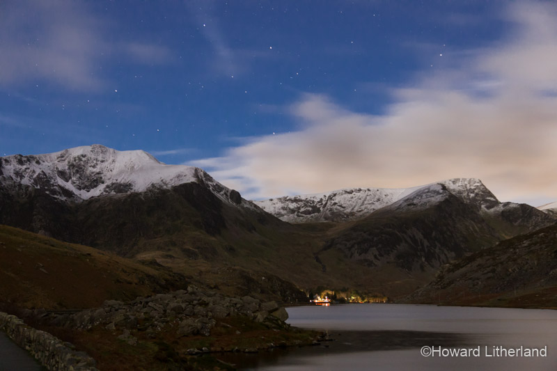 Llyn Ogwen and the Glyderau mountains in winter at night. Snowdonia National Park, North Wales