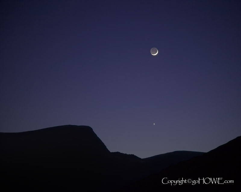 Crescent moon and hill