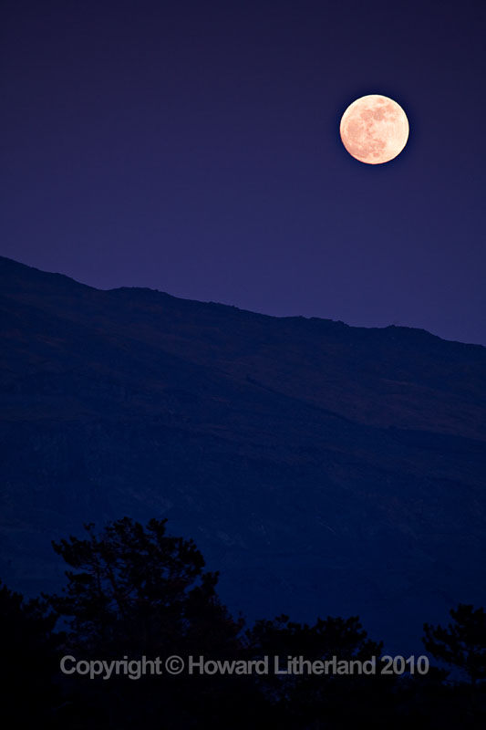 Full moon over hill