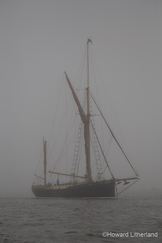 Sailing ship in fog off the Norfolk coast, England