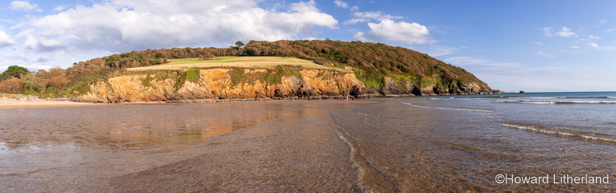Gentle waves on the beach at Porthluney Bay, South Cornwall, England