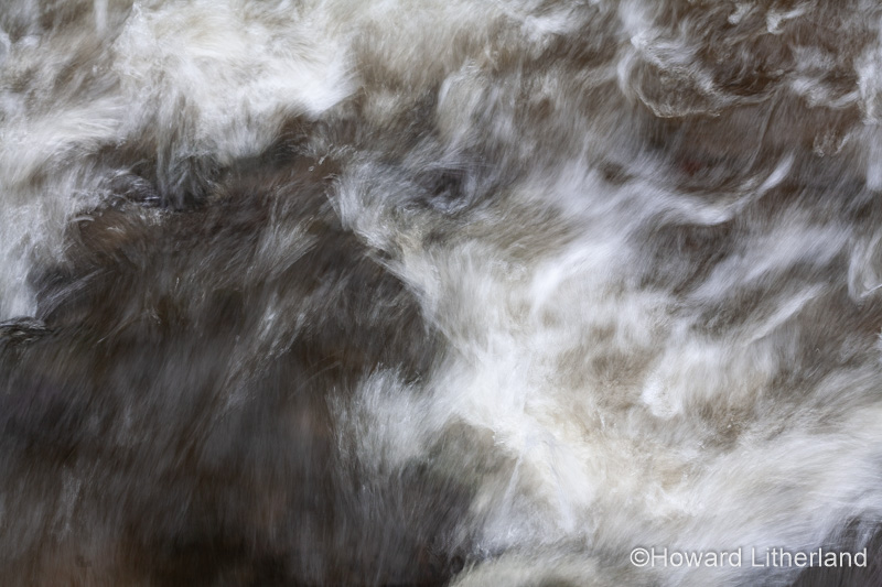 Turbulent river water with motion blur