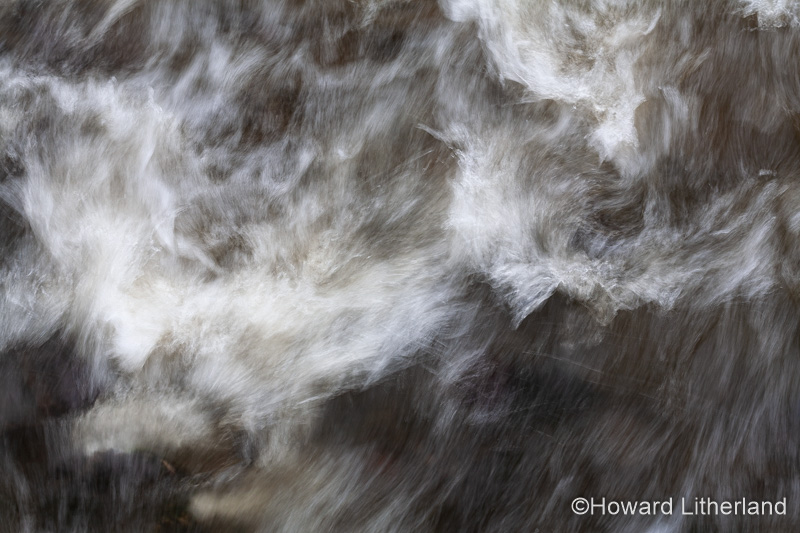 Turbulent river water with motion blur