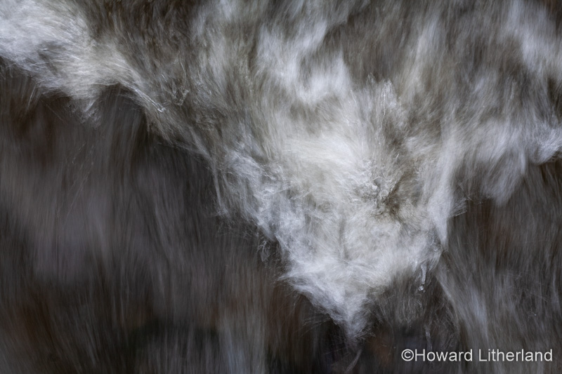 Turbulent river water with motion blur