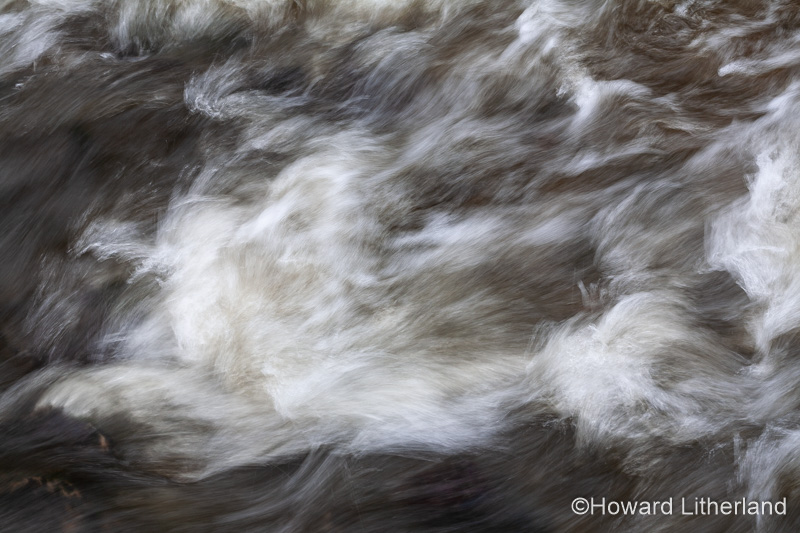 Turbulent river water with motion blur