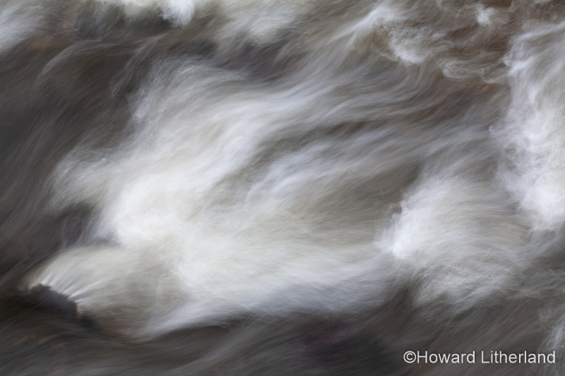 Turbulent river water with motion blur
