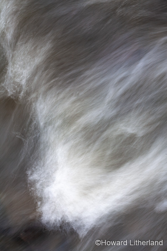 Turbulent river water with motion blur