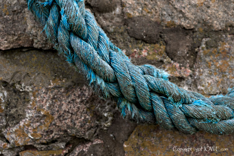 Blue rope against the sea wall at Ravenglass in the Lake District