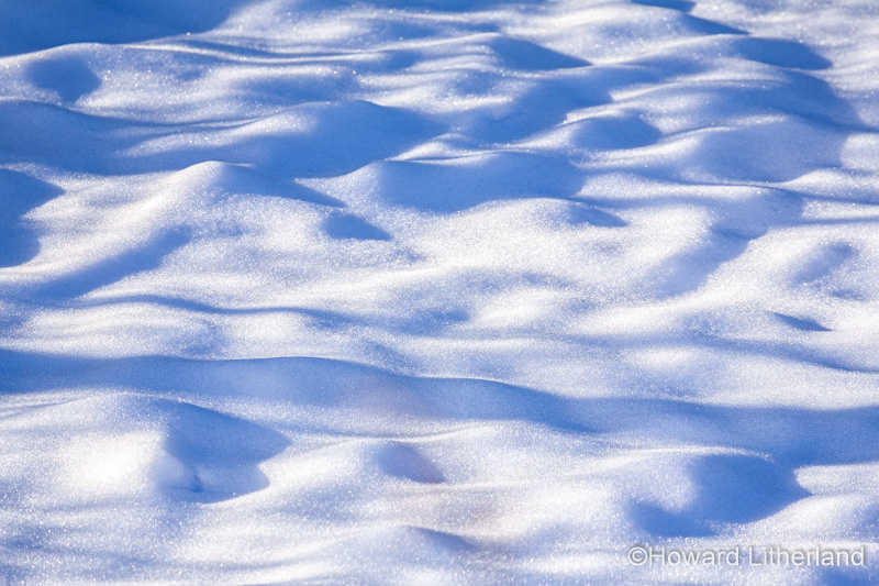 Sunlight and shadow on snow