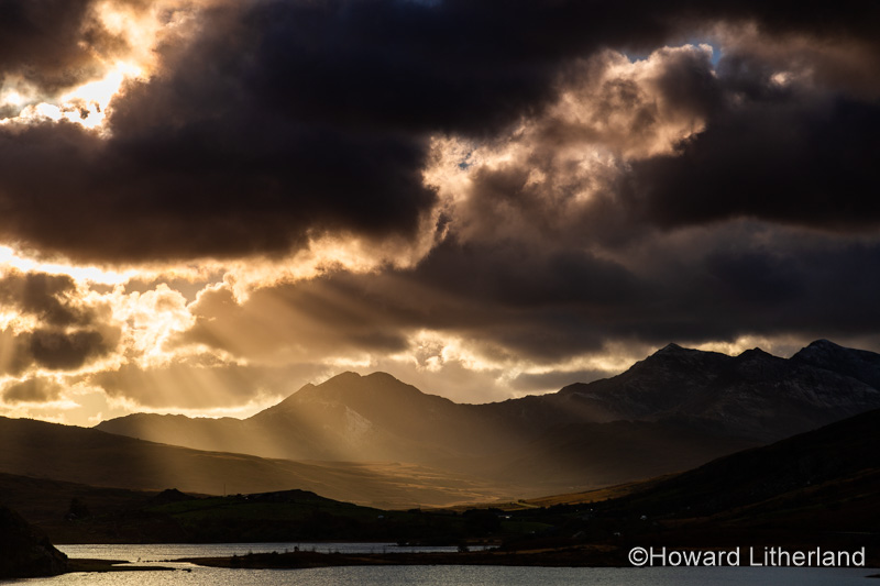 Snowdon mountain with sunbeams and clouds, North Wales