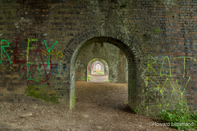 Graffiti on old brick railway arches in Stroud, England