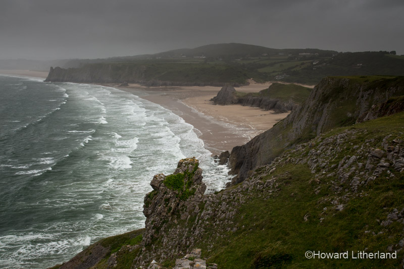 Photo overlooking Three Cliffs Bay in the rain, Gower Peninsula, South Wales coast