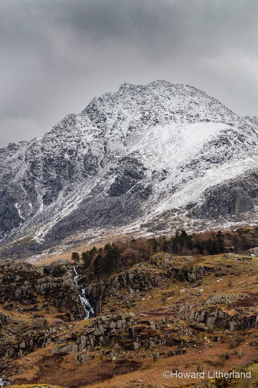 Snow capped peak of Tryfan in the Glyderau as viewed from the Nant Ffrancon valley in Snowdonia, North Wales in wintry conditions