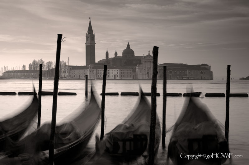 Gondolas at dawn, moored at St Mark's Square with the island of San Giorgio Maggiori in the background, Venice, Italy