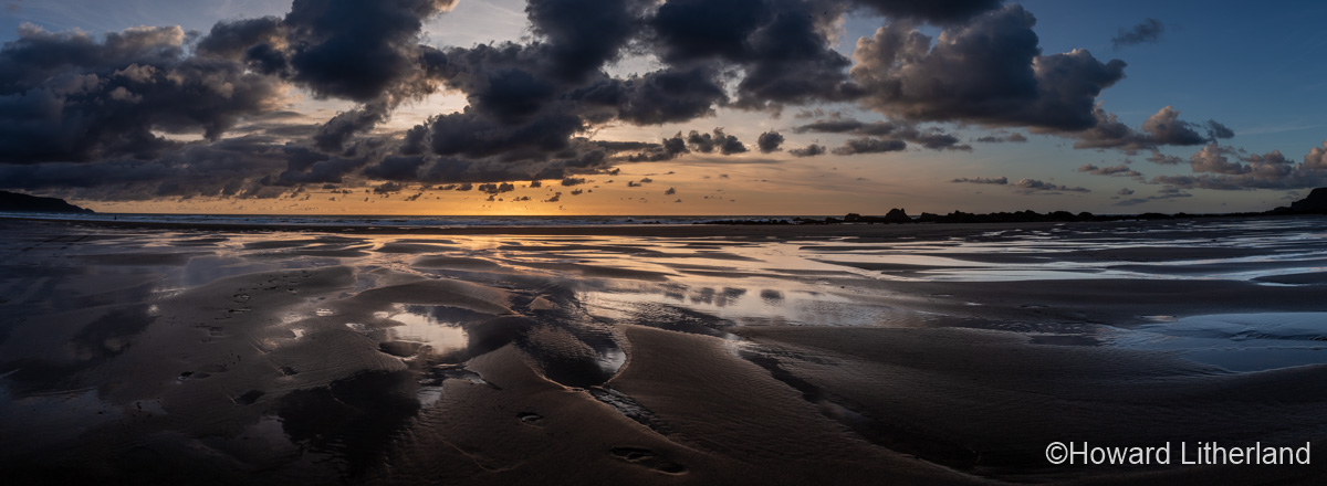 Sunset over the Atlantic ocean from Widemouth Bay beach, North Cornwall, England