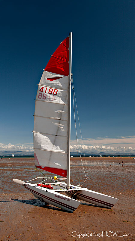 Yacht on the beach at Llanbedrog on the Llyn Peninsula, Wales