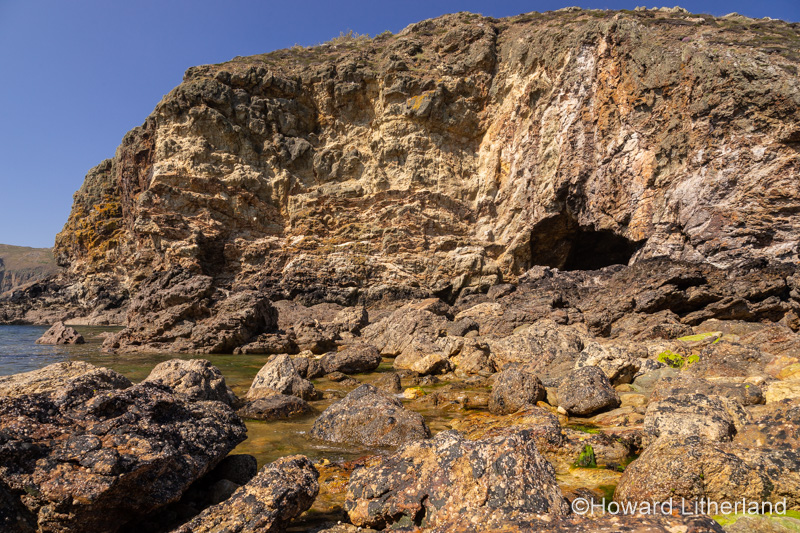 Cliffs and cave at Ynys-y-Fydlyn on the coast of Anglesey, North Wales